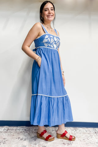 Entro chambray blue thick strap midi length sundress with bow tie back closure and white embroidery details and trim D27052
