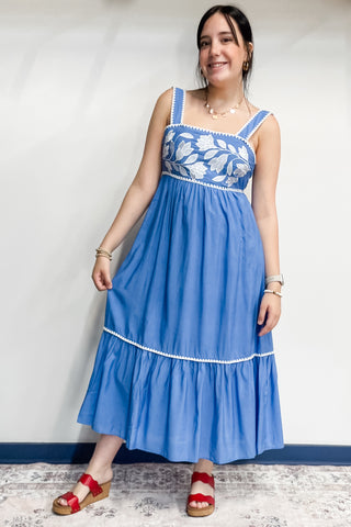Entro chambray blue thick strap midi length sundress with bow tie back closure and white embroidery details and trim D27052