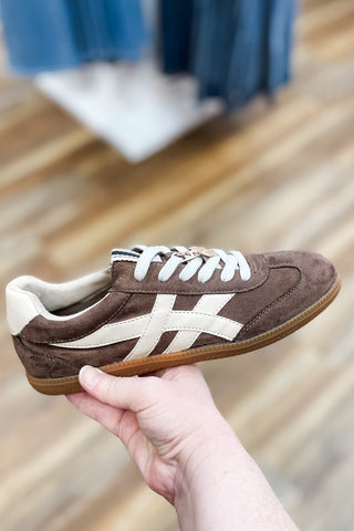 Shu Shop brown suede Sasha low top low profile sneakers with ivory contrast side stripes and heel tab plus a gold charm