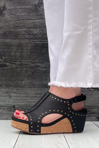 Corkys Footwear Carley Wedge Sandal in Black Oil PU with Studs is a closet staple