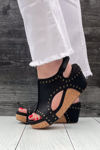 Corkys Footwear Carley Wedge Sandal in Black Oil PU with Studs is a closet staple