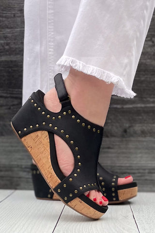 Corkys Footwear Carley Wedge Sandal in Black Oil PU with Studs is a closet staple