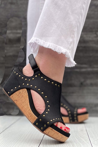 Corkys Footwear Carley Wedge Sandal in Black Oil PU with Studs is a closet staple