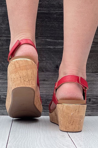 Corkys Footwear Carley wedge sandal in bold red lizard with gold rand trim around corky outsole