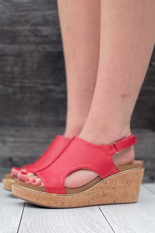 Corkys Footwear Carley wedge sandal in bold red lizard with gold rand trim around corky outsole