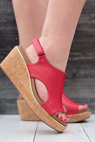 Corkys Footwear Carley wedge sandal in bold red lizard with gold rand trim around corky outsole