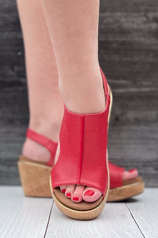 Corkys Footwear Carley wedge sandal in bold red lizard with gold rand trim around corky outsole