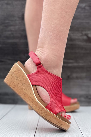 Corkys Footwear Carley wedge sandal in bold red lizard with gold rand trim around corky outsole