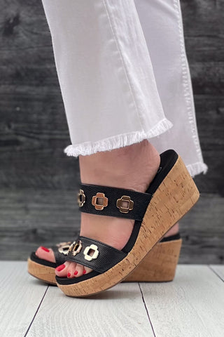 Corkys Footwear Hi Tide Wedge Sandal in Black with Gold Floral Rivets