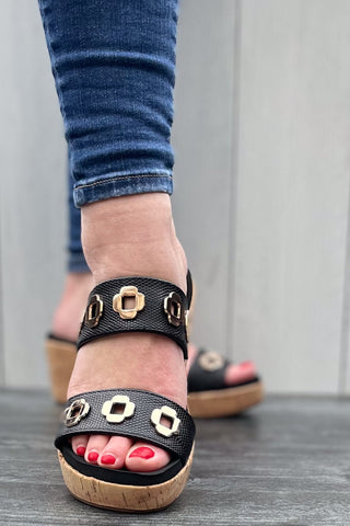 Corkys Footwear Hi Tide Wedge Sandal in Black with Gold Floral Rivets