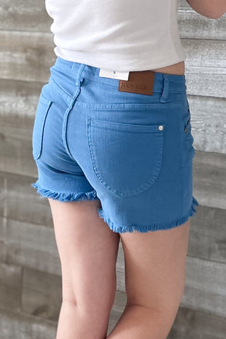 Judy Blue jb150267reg sky blue mid rise garment dyed shield pockets fray hem shorts