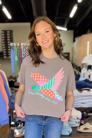 Poppy & Pine How Ducky Are We cropped tee in mocha brown with a patchwork mallard graphic, styled with Just Black longer length straight leg jeans