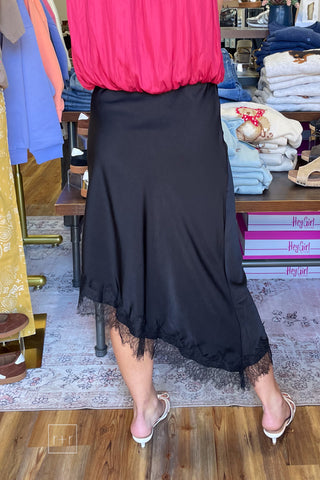Back view of black satin midi skirt with scalloped eyelash lace hem, style SKS16677