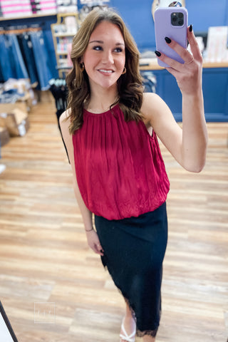 Mirror selfie wearing the black satin lace trim midi skirt, style SKS16677