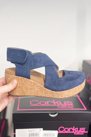 Corkys Footwear Case Closed criss cross wedge shoe in navy faux suede velcro closure