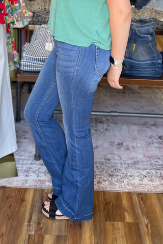 cello pull on flares with elastic waist in medium wash long length side view