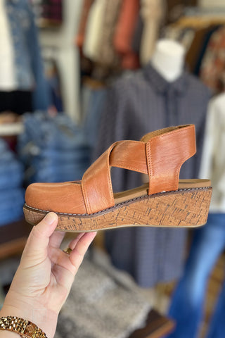 Corkys Footwear cognac Bring It In lower heel wedge closed toe shoe criss cross straps and ankle strap closure side view