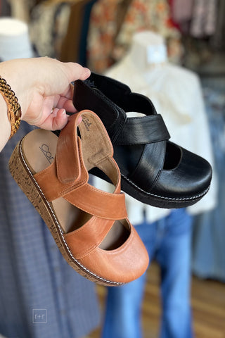 Corkys Footwear Bring It In lower heel wedge closed toe shoe available in cognac and black