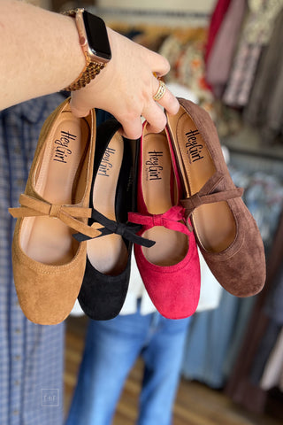Corkys Footwear Layover ballet flats with decorative bow strap square toe cover shot showing all 4 available colors: camel, black, red and chocolate (left to right)