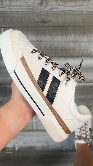 corkys footwear thats her casual sneaker white with black stripes and leopard laces