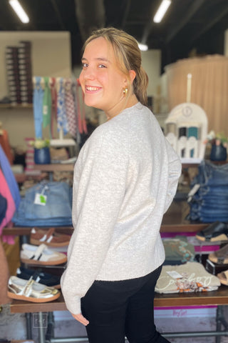 Side view of the ee:some cowboy dachshund sweater SH17268 styled with Judy Blue Black Bootcut Jeans JB881184 and Corkys Footwear Black Whats The Rush wedge shoes
