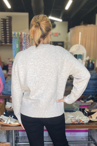 Back view of the ee:some cowboy dachshund sweater SH17268, ribbed hem and relaxed raglan fit