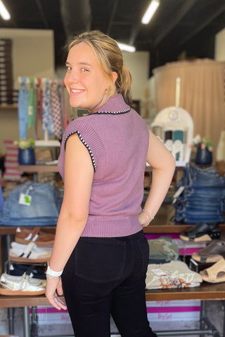 Back view of the dusty plum knit polo sweater showing the contrast stitch trim along the collar and shoulder seams.