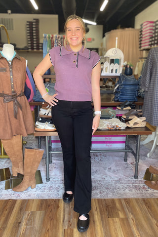 Front view of the dusty plum knit polo sweater showing the pointed collar, two-button placket, and ribbed hem.