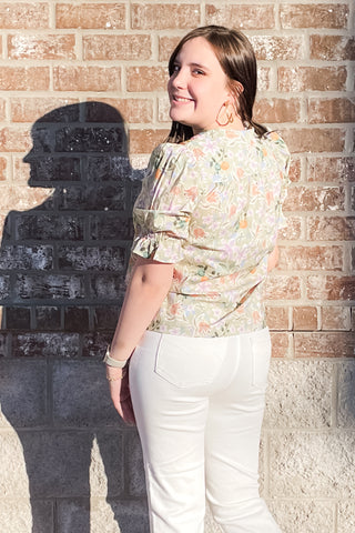 eesome light olive green with all over pastel floral pattern and colorful embroidery framing v-neck with short puff sleeves and elastic ruffle cuff TK14695