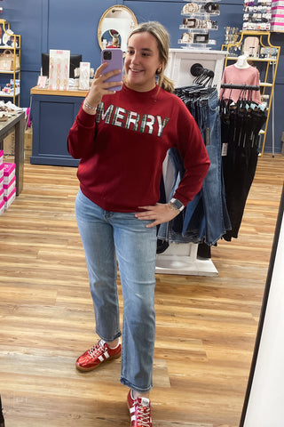 Full-length front view of the Jess Lea Merry Plaid Patch Luxe Pullover in red styled with Judy Blue Peggy Straight Ankle Jeans and red metallic Heads Up sneakers