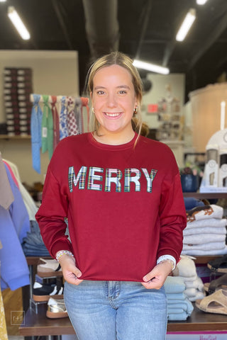 Model wearing the red Jess Lea Merry Plaid Patch Luxe Pullover Christmas sweatshirt with Judy Blue Peggy Straight Ankle Jeans, front view