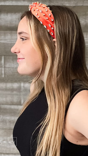 bejeweled velvet knotted headband in orange with clear glass jewels