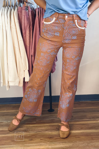 Poppy & Pine brown paisley bandana fray hem jeans styled with a light blue top and tan suede bow ballet flats
