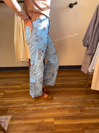 Side view of Poppy & Pine light blue paisley bandana high rise jeans showing the relaxed straight leg