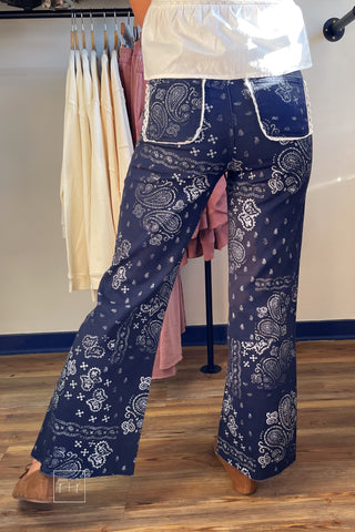 Back view of Poppy & Pine navy paisley bandana fray hem jeans showing the wide straight leg
