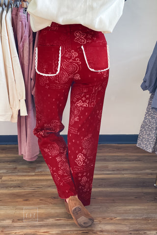 Back view of Poppy & Pine red paisley bandana jeans with lace-trimmed back pockets