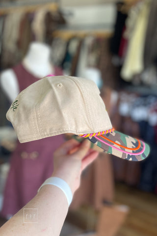 Angled view of Flying Mallard camo baseball cap showing rope detail on the bill