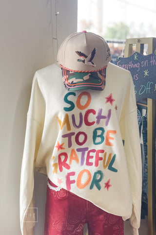 Flying Mallard baseball cap styled with the So Much To Be Grateful For graphic sweatshirt