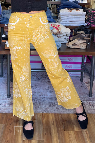 Poppy & Pine mustard paisley bandana high rise jeans styled with a black knit sleeveless sweater and black ballet flats