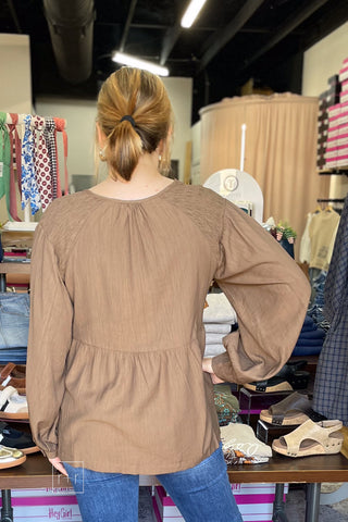 Back view of the Umgee N7223 almond brown crinkle babydoll top showing the length and coverage