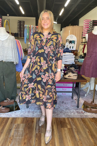Umgee K0651 black fall floral tiered midi dress with v-neck and 3/4 sleeves, styled with Corkys Knot Gonna Happen Mules in gold