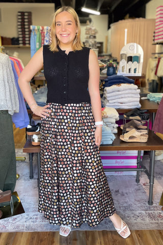 Full-length view of the Umgee C6942 black polka dot pleated maxi skirt