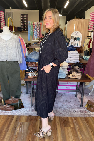 Umgee C6760 black jacquard midi dress showing the side pockets, worn with Corkys Knot Gonna Happen heeled mules in leopard
