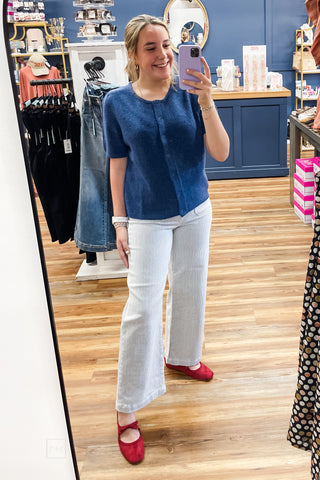 Mirror view of the Umgee denim blue short sleeve button front cardigan D1148 styled with Just Black Denim Navy Pin Stripe Patch Pocket Wide Leg Jeans and Hey Girl by Corkys Layover Ballet Flats in red