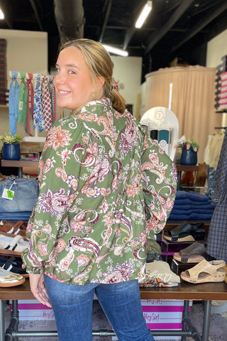 Close-up side view of the Umgee N7201 floral blouse showing the ruffled elastic cuff and voluminous sleeve detail