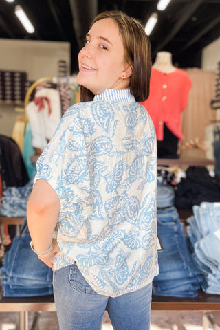 Umgee blue and cream botanical print with contrast stripe trim dolman short sleeve blouse K1776