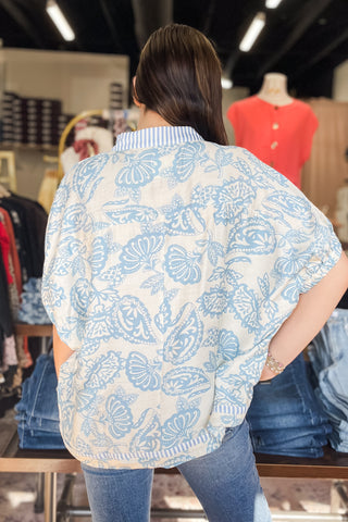 Umgee blue and cream botanical print with contrast stripe trim dolman short sleeve blouse K1776