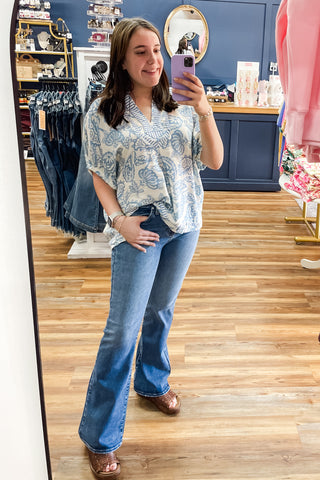 Umgee blue and cream botanical print with contrast stripe trim dolman short sleeve blouse K1776