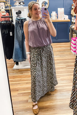 Full-length view of the Umgee C6942 olive polka dot pleated maxi skirt
