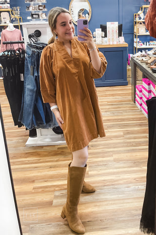 Umgee D1185 camel corduroy shift dress styled with tall brown suede boots, full-length mirror view